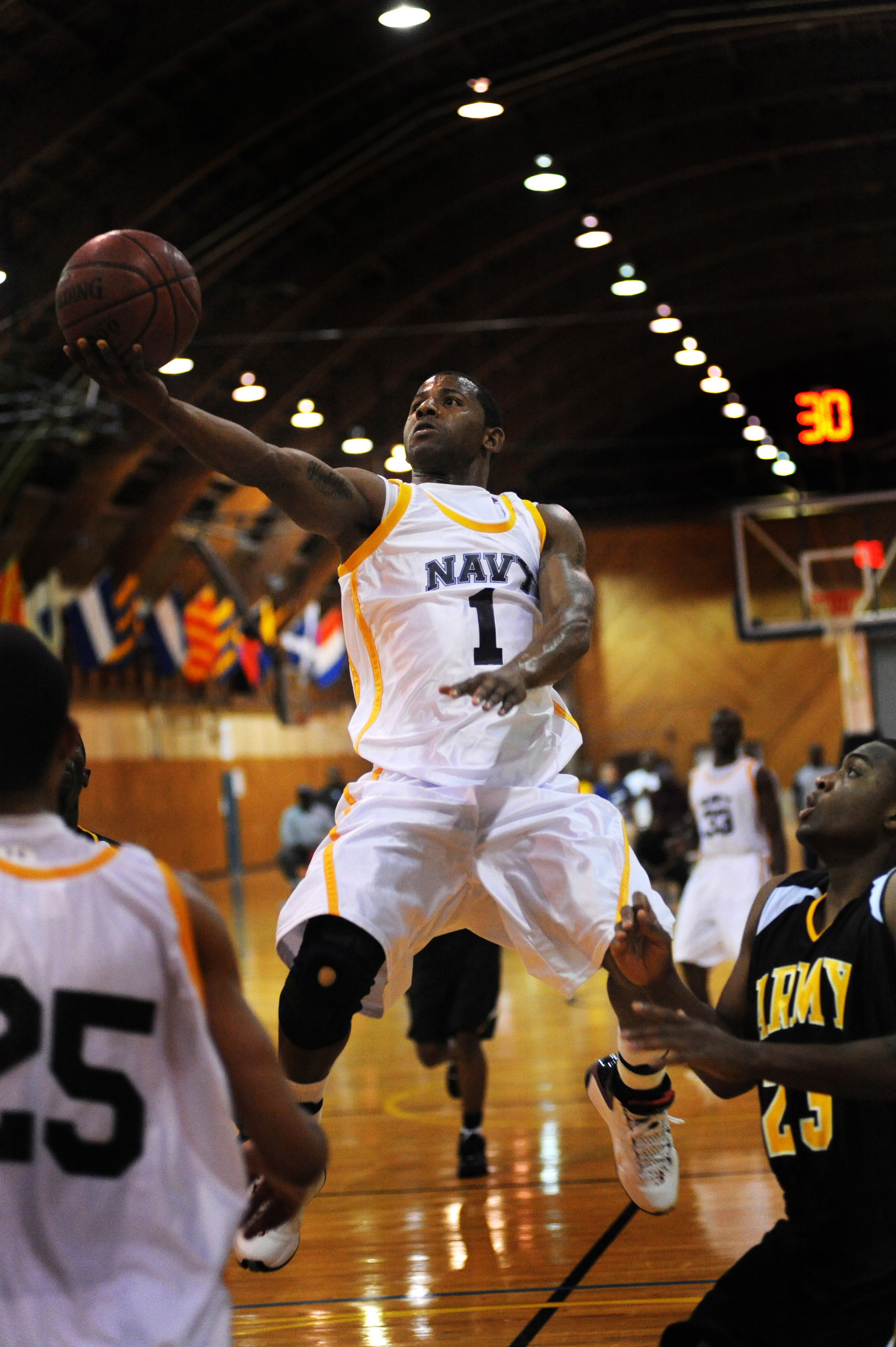 All Navy Guard Seaman Brandon Newman Flies Over An Army Defender