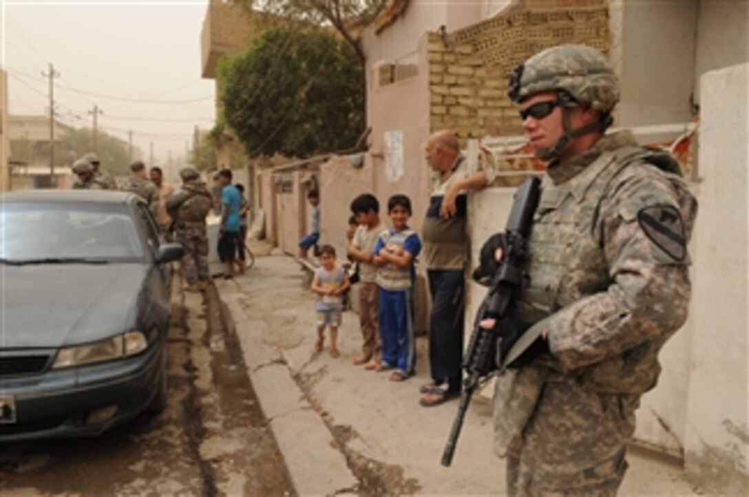 U.S. Army Spc. Justin King from 1st Battalion, 5th Cavalry Regiment, 1st Brigade Combat Team, 1st Cavalry Division provides security during a patrol near Joint Security Station War Eagle in Baghdad, Iraq, on May 6, 2009.  