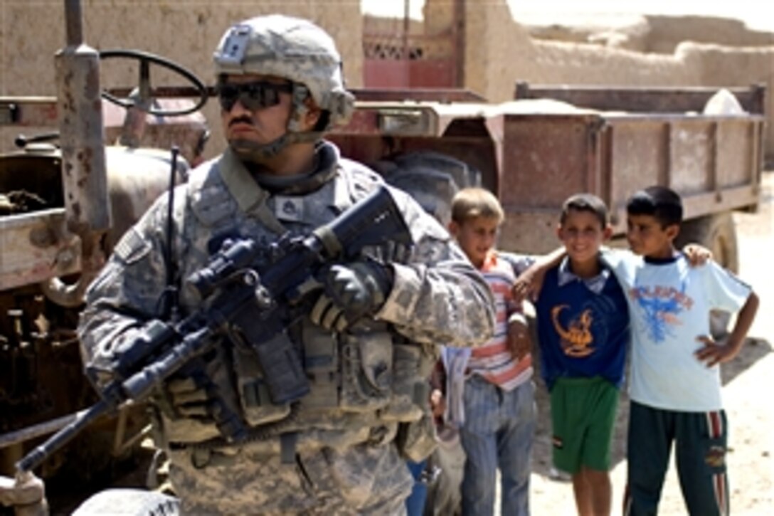 U.S. Army Staff Sgt. Christopher Ybarra provides security during a clearing operation in Alwash, Iraq, May 12, 2009. Ybarra is assigned to the 25th Infantry Division's 5th Battalion, 1st Cavalry Regiment, 1st Stryker Brigade Combat Team.