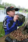 Joey Coates, five, looks through binoculars during a static display at Sears Holdings May 13. The event was part of Marine Week Chicago, which will hold events throughout the Chicago area until Sunday. At the static display Coates and all who attended were able to look through an array of weapons and climb into vehicles used by Marines. They also witnessed an Osprey land and take off from a field at the site.