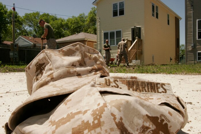 Marines removed their blouses and covers while volunteering for the Windy City Habitat for Humanity on Chicago’s South Side for Marine Week.