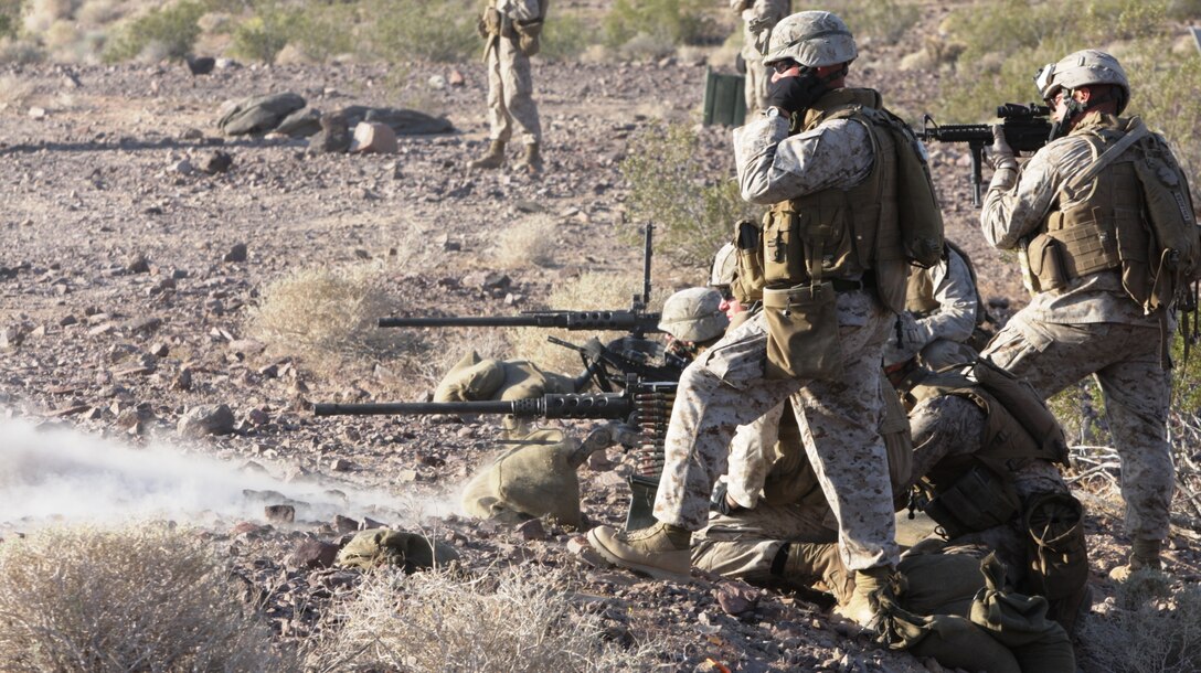 A heavy machine gun team pour rounds down range as Company K, 3rd Battalion, 4th Marine Regiment, puts Combat Center Range 401 to the test, May 15.