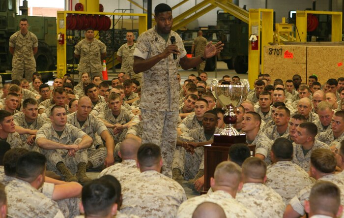 Sgt. Maj. Clifford Wiggins, the battalion sergeant major of 2nd Maintenance Battalion, 2nd Marine Logistics Group, takes a moment to congratulate his Marines and sailors for receiving the Lieutenant General “Chesty” Puller Award for Superior Performance, here, May 15.  After thanking the unit, he quickly refocused his attention on the challenges to come. (Official U.S. Marine Corps photo by Lance Cpl. John A. Faria) (RELEASED)