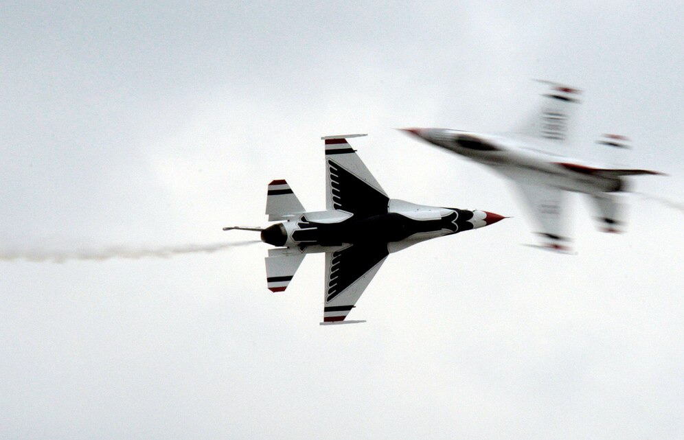 The Air Force Thunderbirds demonstrate one of their maneuvers during the 2009 Joint Service Open House May 15. Local Virginia and Maryland residents couldn't avoid the aerial aerobatics or interactive displays, as an estimated 100,000 people attended the JSOH.