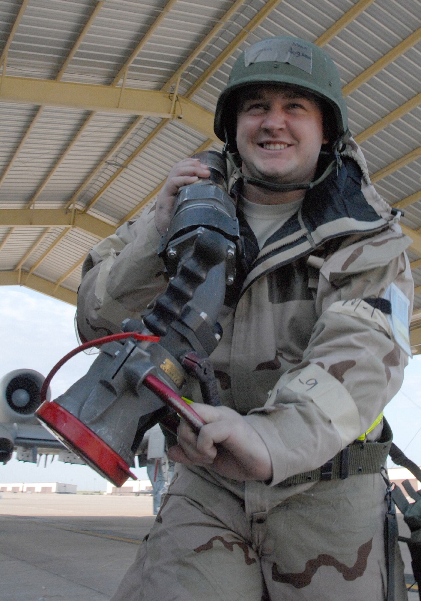 Staff Sgt. Jordan Aggson of the 442nd Logistics Readiness Squadron drags a refueling hose back to his tanker truck after servicing an A-10 Thunderbolt II during an operational readiness exercise at Whiteman Air Force Base, Mo., May 14, 2009. The 442nd LRS is part of the 442nd Fighter Wing, an Air Force Reserve Command A-10 unit. The ORE was a dry run for the wing's upcoming operational readiness inspection in October. (U.S. Air Force photo/Master Sgt. Bill Huntington)