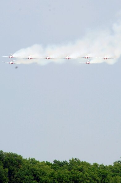 The Canadian Forces Snowbirds perform during the 2009 Defenders of Liberty Air show May 9. This year marks the 100th anniversary of the first powered, heavier-than air, controlled flight in Canada. (U.S. Air Force photo by Airman 1st Class Brittany Y. Bateman)(RELEASED)