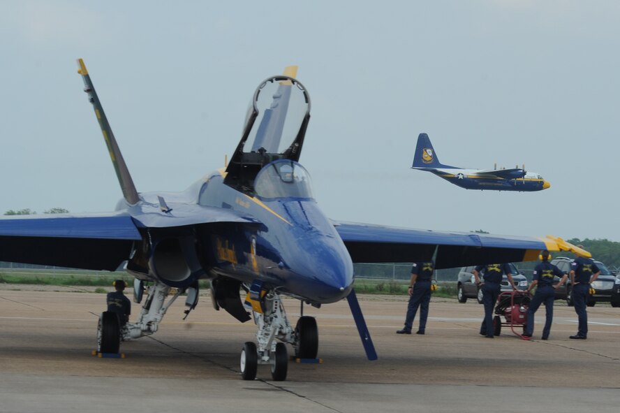 The Navy Flight Demonstration Flight, Blue Angels Maintenance and Support Team watches Fat Albert fly by during the 2009 Defenders of Liberty Air show  May 9. The Blue Angels maintenance and support team is comprised of the events coordinator, maintenance officer, flight surgeon, administrative officer, public affairs officer, supply officer and approximately 110 enlisted Navy and Mairne Corps volunteers. (U.S. Air Force photo by Airman 1st Class Brittany Y. Bateman)(RELEASED)