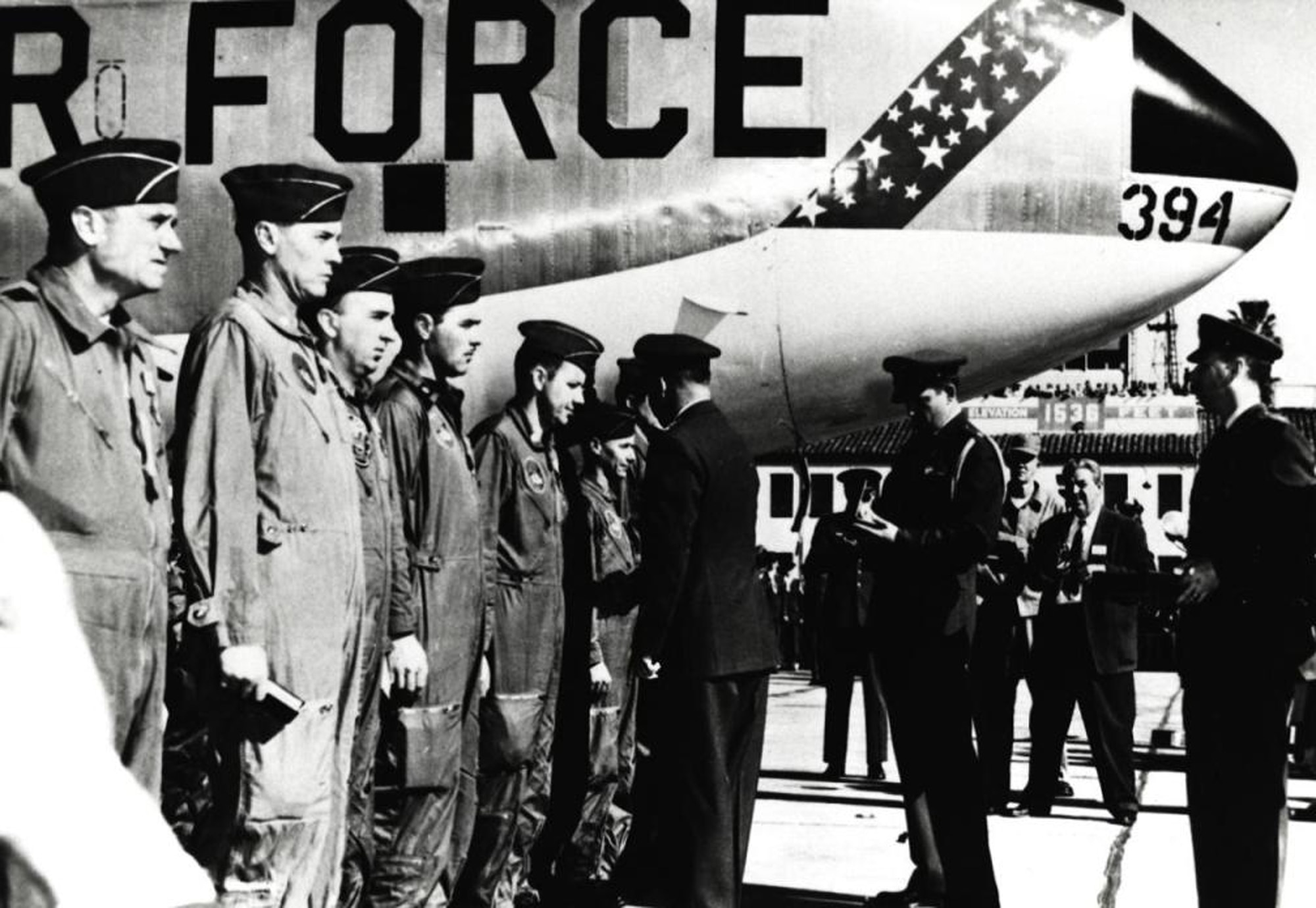 During a ceremony at March AFB, Calif., on Jan. 18, 1957, Gen. Curtis E. LeMay presents the Distinguished Flying Cross to the crew of Lucky Lady III.  At far left is Maj. Gen. Archie J. Old Jr., Fifteenth Air Force commander.  The aide behind General Lemay is Maj. David C. Jones, later to become Air Force chief of staff and chairman of the joint chiefs.