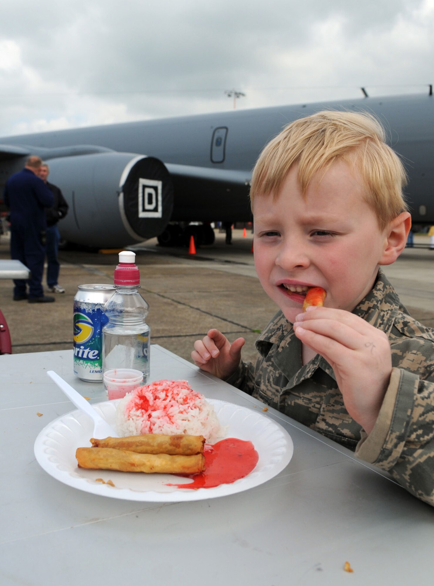 Noah Ogle, 6, son of Senior Master Sgt. William Ogle and his wife, Kim, enjoys lunch in front of a 100th Air Refueling Wing KC-135 during RAF Mildenhall’s 75th Anniversary celebration May 15.  (U.S. Air Force photo by Staff Sgt. Austin M. May)