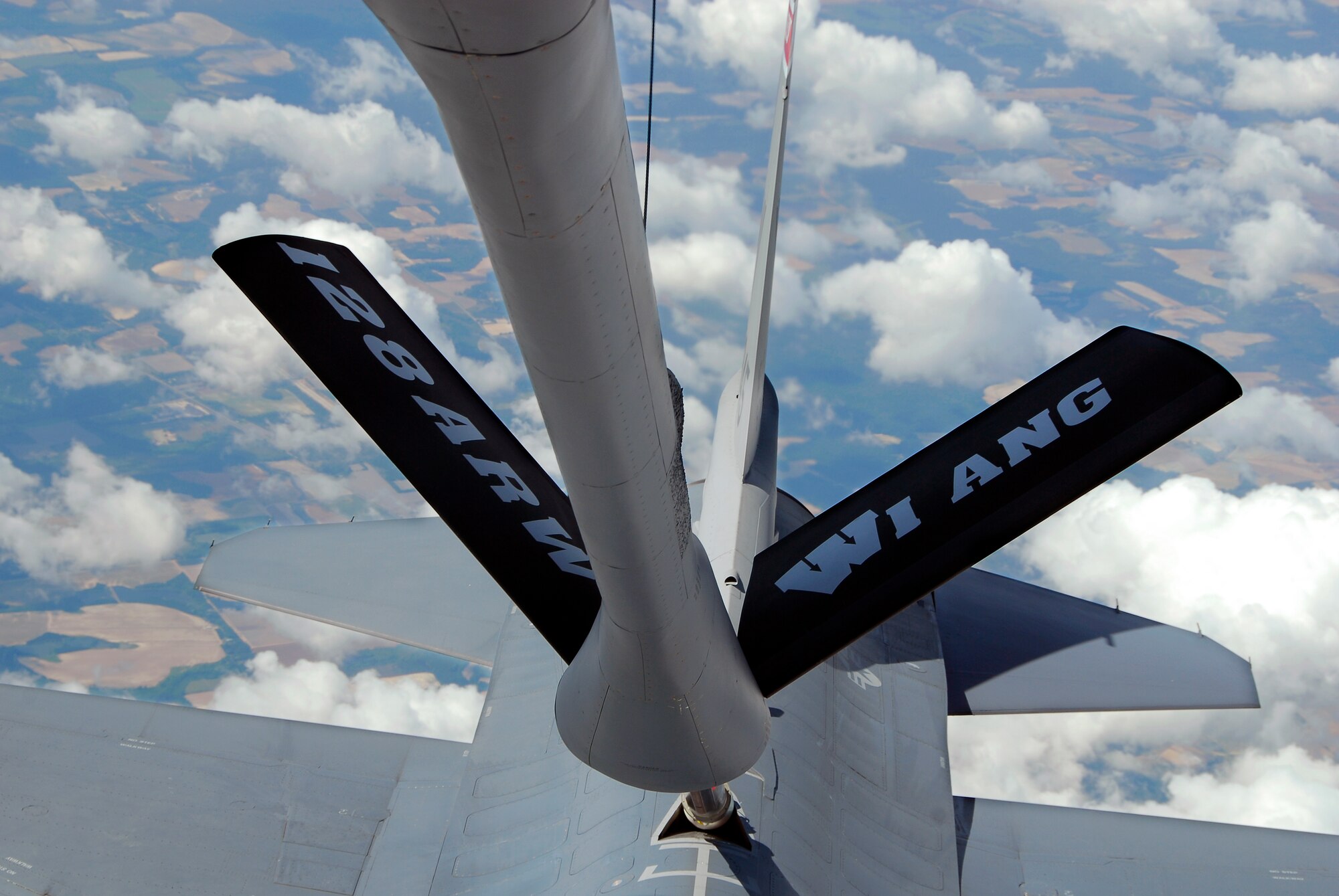 An F-16C Fighting Falcon from the 115th Fighter Wing, Madison, Wis. is refueled by a KC-135R Stratotanker from the 128th Air Refueling Wing, Milwaukee, Wis. The 115th FW participated in an air-to-air combat skills training exercise April 18 - May 2, 2009 along side their naval counterparts from Strike Fighter Squadron 2 (VFA-2), Naval Air Station Lemoore, Calif., while stationed at Naval Air Station Key West, Fla.  The training missions featured air-to-air and air-to-ground offensive and defensive combat tactics designed to simulate real-world operations.  (U.S. Air Force photo by Master Sgt. Dan Richardson)