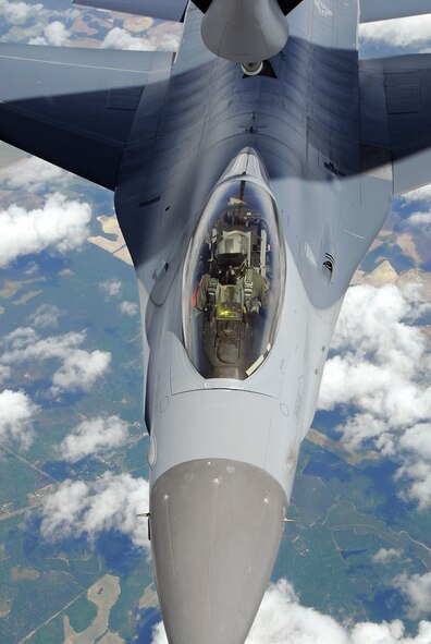 An F-16C Fighting Falcon from the 115th Fighter Wing, Madison, Wis. is refueled by a KC-135R Stratotanker from the 128th Air Refueling Wing, Milwaukee, Wis. The 115th FW participated in an air-to-air combat skills training exercise April 18 - May 2, 2009 along side their naval counterparts from Strike Fighter Squadron 2 (VFA-2), Naval Air Station Lemoore, Calif., while stationed at Naval Air Station Key West, Fla.  The training missions featured air-to-air and air-to-ground offensive and defensive combat tactics designed to simulate real-world operations.  (U.S. Air Force photo by Master Sgt. Dan Richardson)