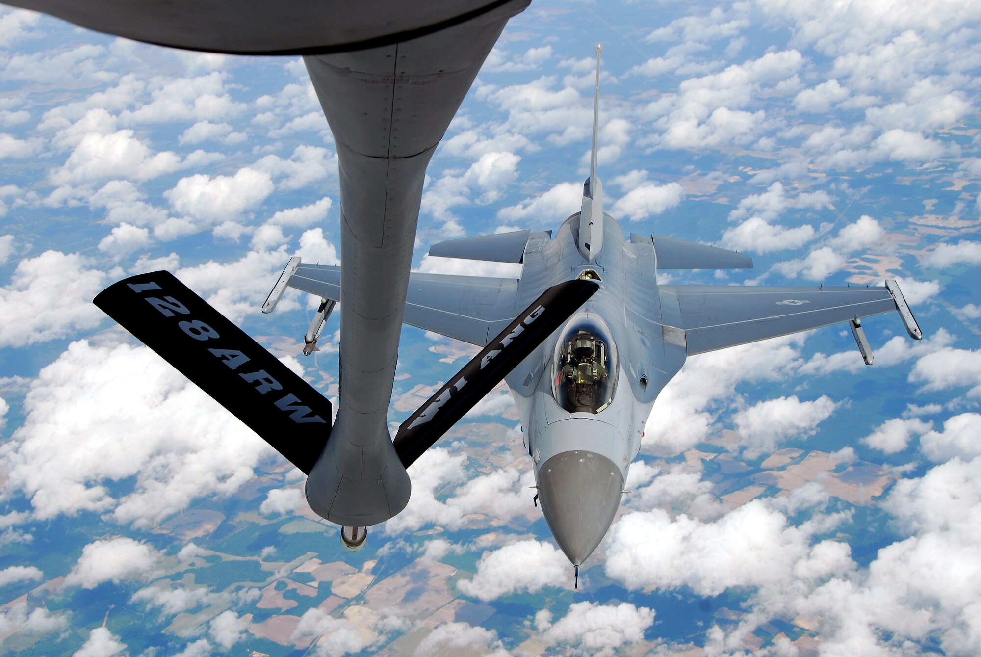 An F-16C Fighting Falcon from the 115th Fighter Wing, Madison, Wis. prepares to be refueled by a KC-135R Stratotanker from the 128th Air Refueling Wing, Milwaukee, Wis. The 115th FW participated in an air-to-air combat skills training exercise April 18 - May 2, 2009 along side their naval counterparts from Strike Fighter Squadron 2 (VFA-2), Naval Air Station Lemoore, Calif., while stationed at Naval Air Station Key West, Fla.  The training missions featured air-to-air and air-to-ground offensive and defensive combat tactics designed to simulate real-world operations.  (U.S. Air Force photo by Master Sgt. Dan Richardson)