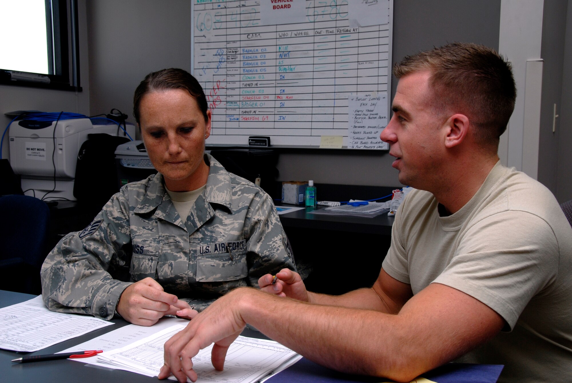 Technical Sgt. Virginia Krauss, a knowledge operations craftsman, and Master Sgt. Aaron Thorenson, an aviation resource management craftsman, both with the 115th Fighter Wing, Madison, Wis., work toghether to file flight plans for the units F-16 pilots.  The 115th Fighter Wing participated in an air-to-air combat skills training exercise April 18 - May 2, 2009 along side their naval counterparts from Strike Fighter Squadron 2 (VFA-2), Naval Air Station Lemoore, Calif., while deployed to Naval Air Station Key West, Fla.  The training missions featured air-to-air and air-to-ground offensive and defensive combat tactics designed to simulate real-world operations.  (U.S. Air Force photo by: Master Sgt. Dan Richardson)