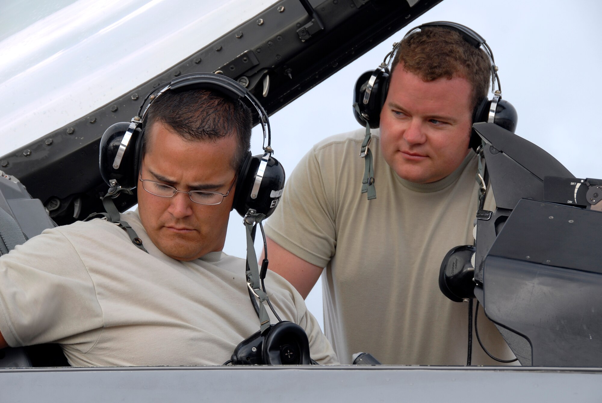Technical Sgt. Brian Stapley (left) and Technical Sgt. Matt Randall (right), avionics technicians with the 115th Fighter Wing, Madison, Wis., perform an operational check of avionics equipment on one of the units F-16C aircraft April 30, 2009. The 115th FW participated in an air-to-air combat skills training exercise April 18 - May 2, 2009 along side their naval counterparts from Strike Fighter Squadron 2 (VFA-2), Naval Air Station Lemoore, Calif., while deployed to Naval Air Station Key West, Fla.  The training missions featured air-to-air and air-to-ground offensive and defensive combat tactics designed to simulate real-world operations.  (U.S. Air Force photo by: Master Sgt. Dan Richardson)