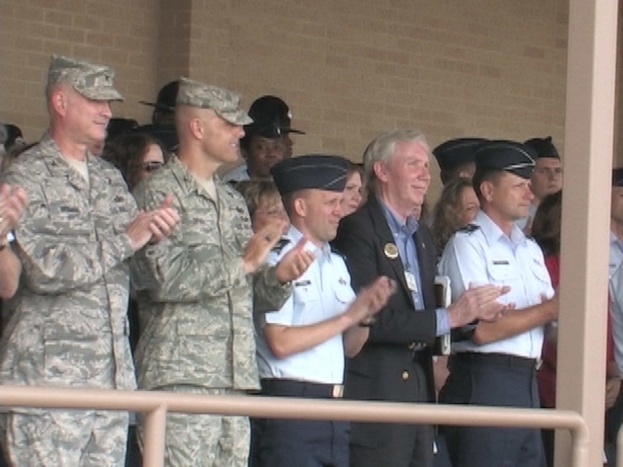 Col. Spacy and the Mayor of Fairborn Gary Woodward join 37th TRW leadership as graduating Airmen pass in review. Col. Bradley D. Spacy, 88th Air Base Wing commander, hosted more than 25 local civic leaders on a tour of Lackland Air Force Base’s 37th Training Wing May 7-8 to highlight the intensive training that goes into  creating today’s warrior Airmen. (U.S. Air Force photo/Ken LaRock)