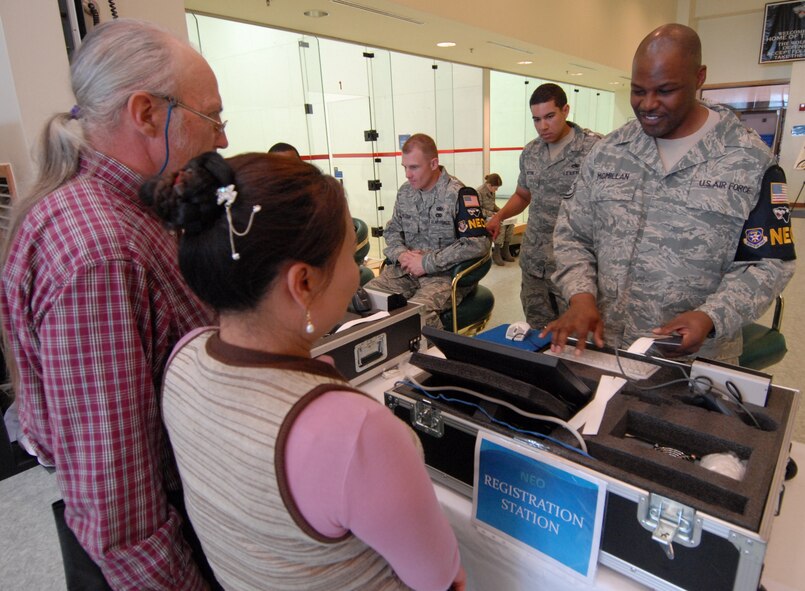 Master Sgt. Steven McMillan, 8th Comptroller Squadron, outprocesses civilians during the non-combatant evacuation operation Courageous Channel 09-01 at Kunsan Air Base, Republic of Korea, May 15. The exercise, which ran from May 14 through the 16, was mandatory for all family members of both servicemembers and DoD civilians as well as all non-emergency essential DoD civilians. (U.S. Air Force Photo/Senior Airman Gustavo Gonzalez)