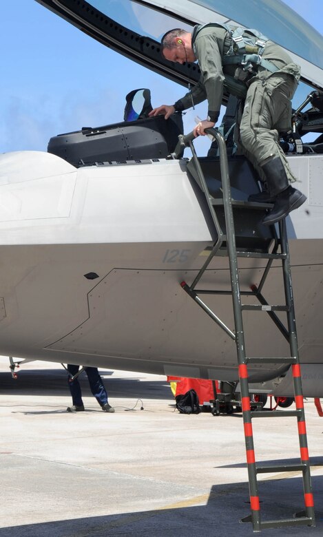 ANDERSEN AIR FORCE BASE, Guam – Lt. Col. Charles S. Corcoran, 525th Expeditionary Fighter Squadron commander, climbs out of an F-22A Raptor after a nine-hour flight from his home station Elmendorf Air Force Base, Alaska. The Raptors from the 525th EFS, also known as the “5-2-5,” are deployed in support of the Pacific Command’s Theatre Support Package. (U.S. Air Force photo by Christopher Bush)