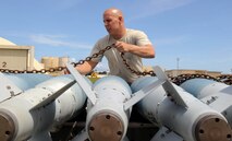 ANDERSEN AIR FORCE BASE, Guam - Senior Airman James Lowery, 36th Expeditionary Aircraft Maintenance Squadron B-2 weapons load crew member, prepares munitions to be loaded on the B-2 Spirit. The Cave-In-Rock, Ill., native is deployed to Andersen Air Force Base, Guam, from Whiteman AFB, Mo. The B-2 flew in Polar Lightning, a long distance training mission, from Andersen AFB to Elmendorf AFB, Alaska, and back. (U.S. Air Force photo by SrA Christopher Bush) 