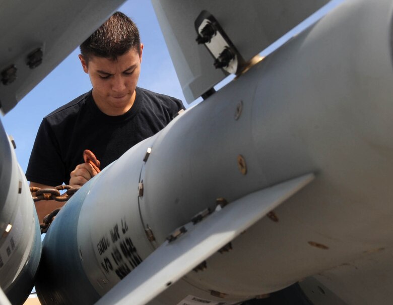 ANDERSEN AIR FORCE BASE, Guam - Senior Airman Louie E. Gaitan, 36th Expeditionary Aircraft Maintenance Squadron B-2 weapons load crew member, prepares munitions to be loaded on the B-2 Spirit. The Highland Falls, N.Y., native is deployed to Andersen Air Force Base, Guam, from Whiteman AFB, Mo. The B-2 flew in Polar Lightning, a long distance training mission, from Andersen AFB to Elmendorf AFB, Alaska, and back. (U.S. Air Force photo by SrA Christopher Bush) 
