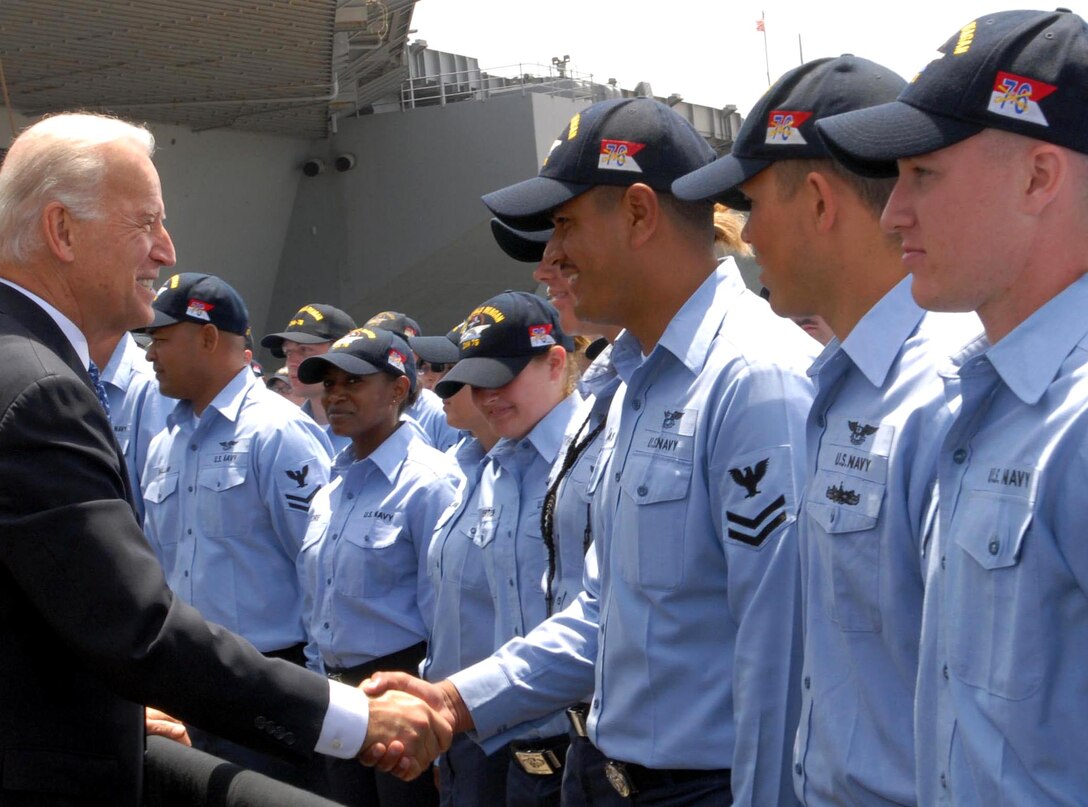 Vice President Joe Biden shakes hands on the pier with sailors from the aircraft carrier USS Ronald Reagan on Naval Air Station, North Island, Calif., May 14, 2009.