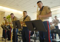 Members of the Marine Air Ground Combat Center Twenty-nine Palms Jazz Ensemble play a few songs for spectators at Arlington Park May 15 during Marine Week Chicago.