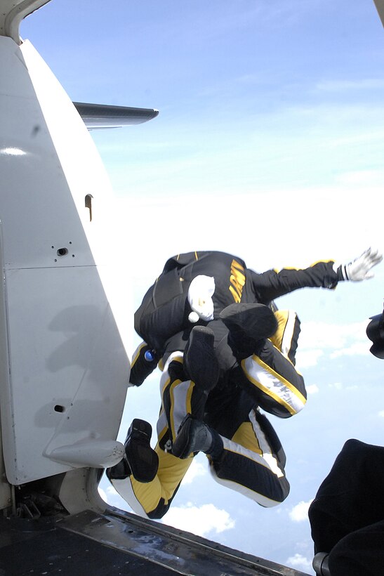 The U.S. Army Golden Knights performs a tandem jump during the Joint Service Open House May 15 at Andrews Air Force Base, Md. The JSOH offers an opportunity for service members to meet and thank the public for their support and to show them America’s skilled military. (U.S. Air Force photo by Senior Airman Giang Nguyen)