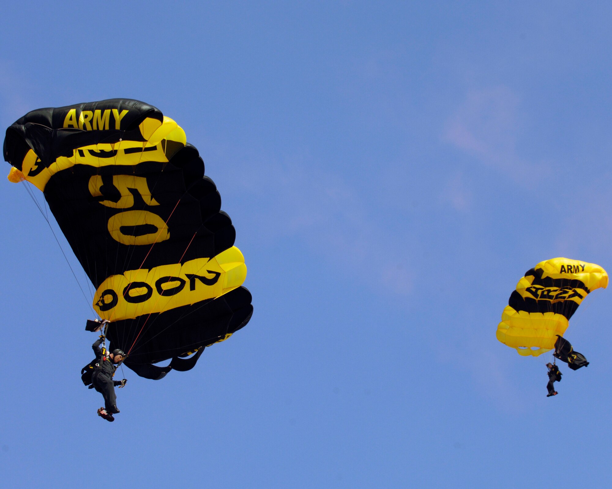 The US Army Golden Knights parachute demonstration team perform in honor of their 50th anniversary May 15 at the Joint Service Open House at Andrews Air Force Base, Md. The JSOH allows members of the public to meet and interact with the men and women of the Armed Forces. (U.S. Air Force photo by Senior Airman Renae L. Kleckner)