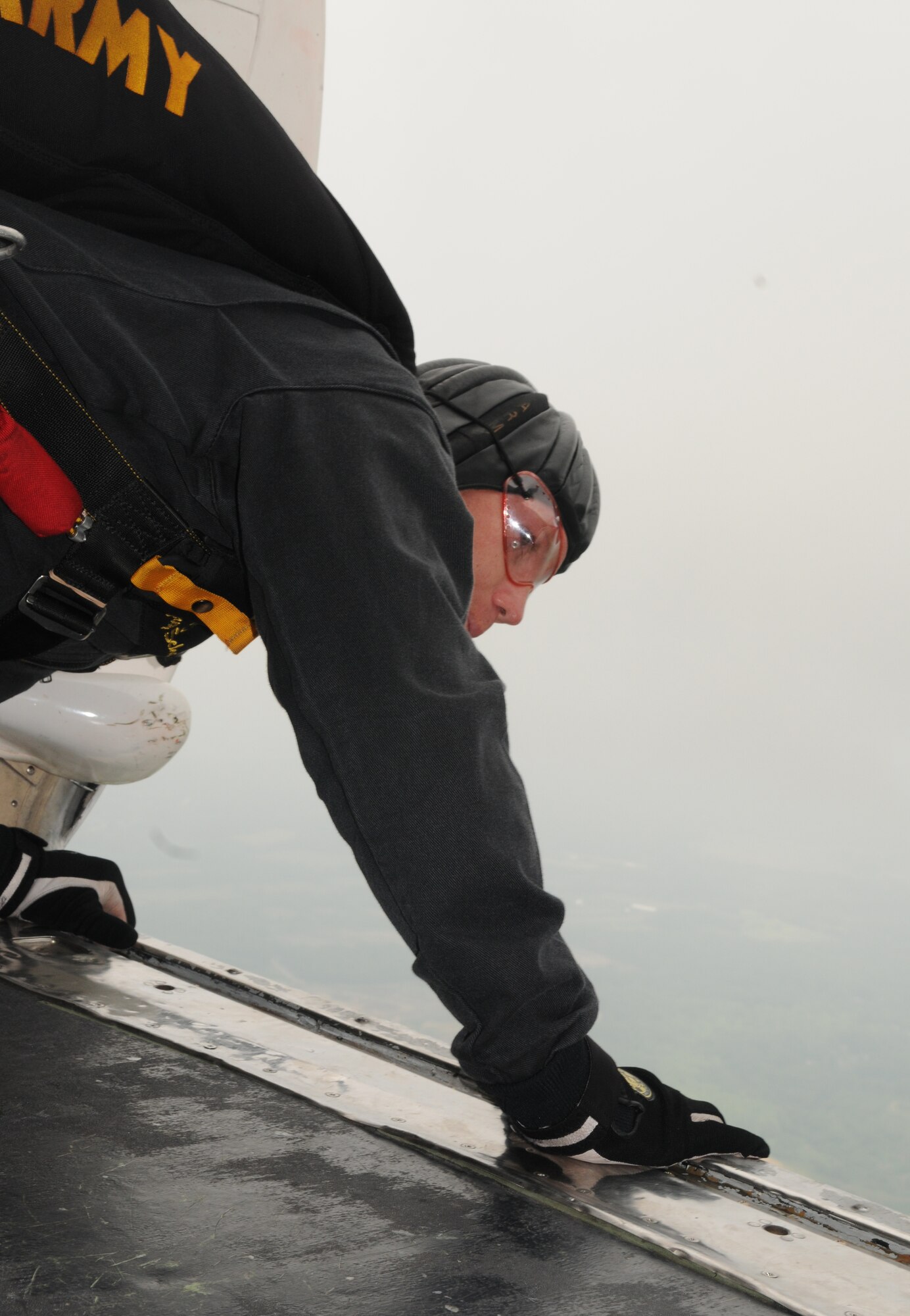 Army Sgt. First Class Jeffrey Schafar, from the U.S. Army’s Golden Knights parachute team, peers through the open door of a Fokker C-31A aircraft during the Joint Service Open House May 16 at Andrews Air Force Base, Md.  JSOH offers an opportunity for service members to meet and thank the public for their support and to show them America’s skilled military. (U.S. Air Force photo by Senior Airman Sean Adams)