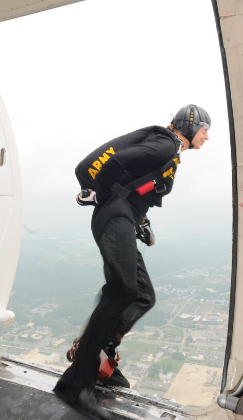 Army Sgt. Rachel Haddon from the U.S. Army’s Golden Knights parachute team,  jumps from a Fokker C-31A aircraft during the Joint Service Open House May 16 at Andrews Air Force Base, Md.  JSOH offers an opportunity for service members to meet and thank the public for their support and to show them America’s skilled military. (U.S. Air Force photo by Senior Airman Sean Adams)