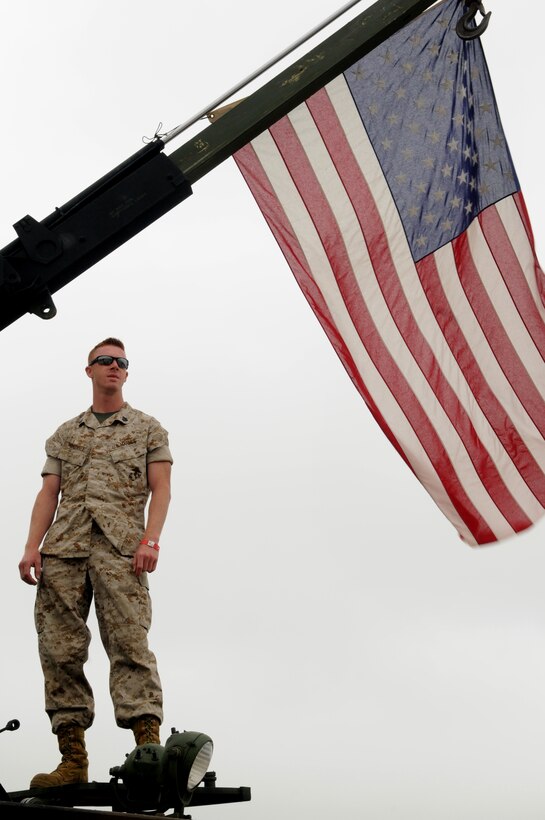 Marine Sgt. Thomas Whedbee, 4th LAR Battalion, D Company, stationed at  Quantico, Va., surveys the crowd during the Joint Service Open House May 16 at Andrews Air Force Base, Md.  JSOH offers an opportunity for service members to meet and thank the public for their support and to show them America’s skilled military. (U.S. Air Force photo by Senior Airman Sean Adams)