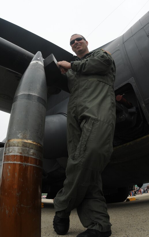 Technical Sgt. Scott Evans, 16th Special Operations Squadron at Hurlburt Field, Fla., stands with an example of a single round of ammunition from his AC-130H Spectre Gunship during the Joint Service Open House May 16 at Andrews Air Force Base, Md.  JSOH offers an opportunity for service members to meet and thank the public for their support and to show them America’s skilled military. (U.S. Air Force photo by Senior Airman Sean Adams)