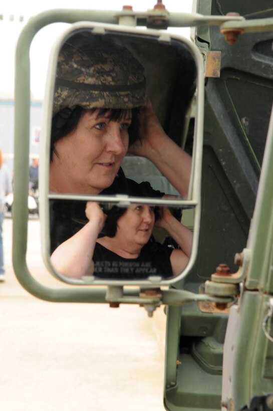Sheila Grable of Elkridge, Md., tries on a Kevlar helmet during the Joint Service Open House May 16 at Andrews Air Force Base, Md.  JSOH offers an opportunity for service members to meet and thank the public for their support and to show them America’s skilled military. (U.S. Air Force photo by Senior Airman Sean Adams)