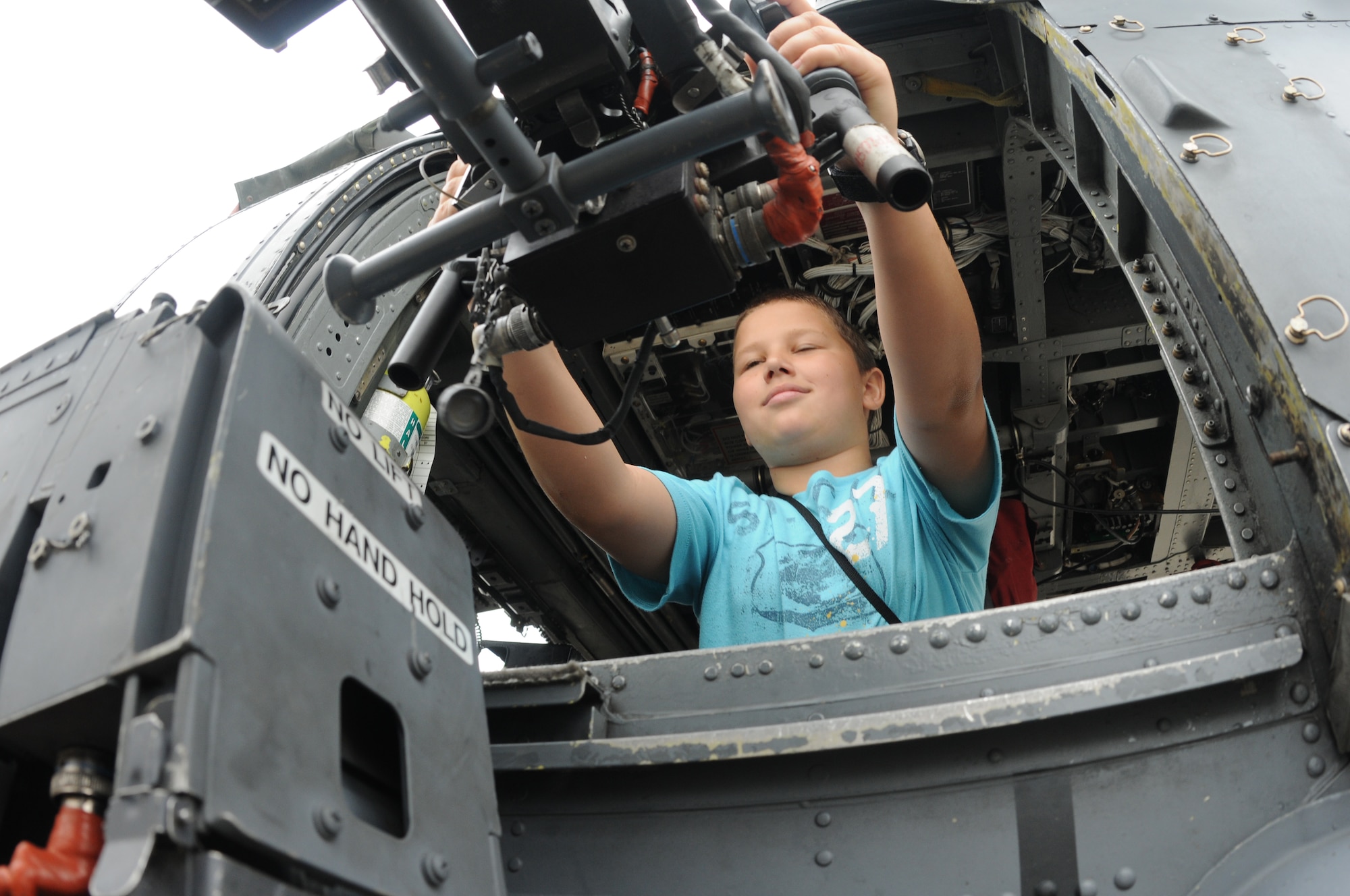 Jon Lupo of Montgomery County, Md., experiences life as an aerial gunner on an HH-60 Pave Hawk during the Joint Service Open House May 16 at Andrews Air Force Base, Md.  JSOH offers an opportunity for service members to meet and thank the public for their support and to show them America’s skilled military. (U.S. Air Force photo by Senior Airman Sean Adams)