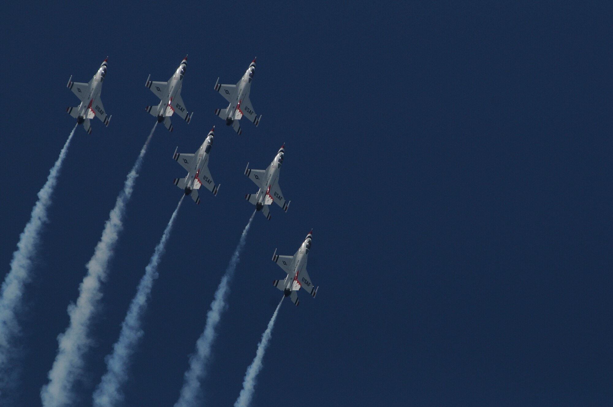 The U.S. Air Force Thunderbirds perform during the 2009 Joint Service Open House May 16 on Andrews Air Force Base, Md. The Thunderbirds perform about 70 shows in 35 different locations for more than 10 million people each year. JSOH offers an opportunity for service members to meet and thank the public for their support and to show them America's skilled military. (U.S. Air Force photo by Staff Sgt. Dan DeCook)