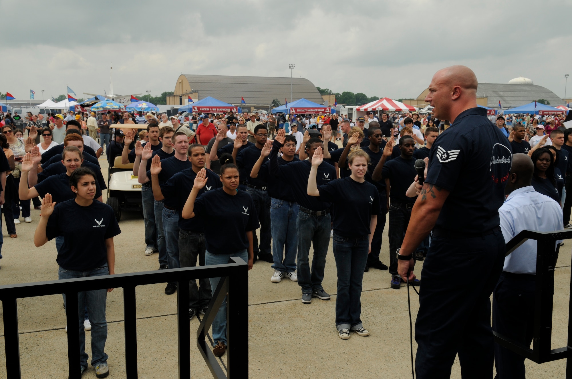 Staff Sgt. Jason Wildman, Thunderbirds team recruiter, prepares future Airmen for an enlistment ceremony at the 2009 Joint Service Open House May 16 on Andrews Air Force Base, Md. JSOH is an open interactive experience for service members and the public they serve. (U.S. Air Force photo by Staff Sgt. Dan DeCook)