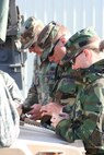 Members of the 185th Air Refueling Wing Security Forces from Sioux City, Iowa loads blanks into magazines for a land navigation training exercise during Operation Northern Thunder at Fort Harrison, Montana on May 15, 2009. (U.S. Air Force photo by Tech. Sgt. Wendy S. Ohl)