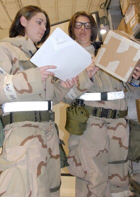 Airman Tiffany Loman and Senior Airman Rebecca Householder, 442nd Logistics Readiness Squadron, take inventory of supplies during an operational readiness exercise at Whiteman Air Force Base, Mo., May 15. The 442nd LRS is part of the 442nd Fighter Wing, an Air Force Reserve Command A-10 Thunderbolt II unit. (U.S. Air Force photo/Master Sgt. Bill Huntington)