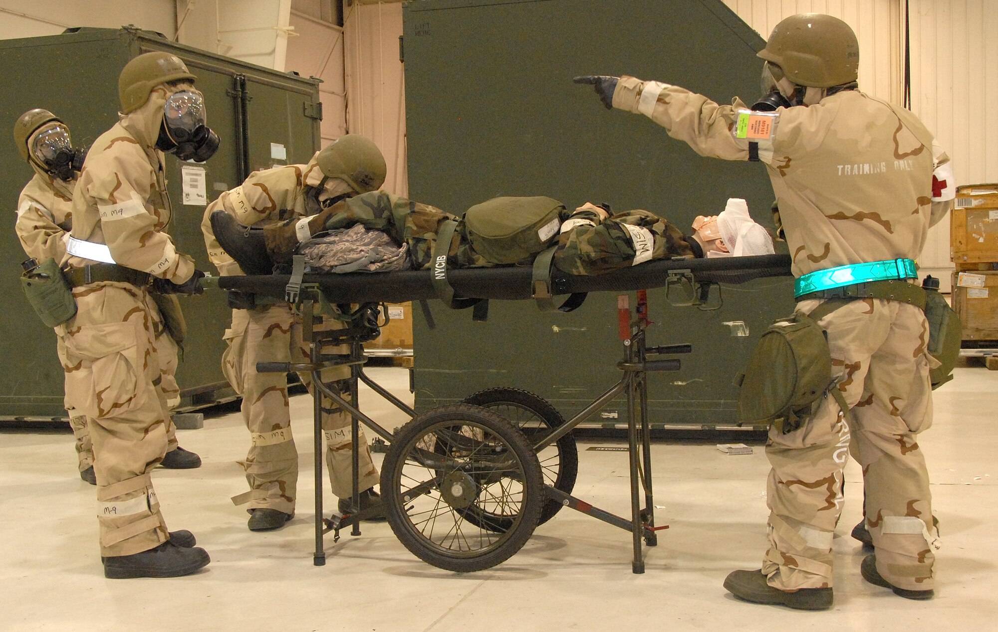442nd Logistics Readiness Squadron and 442nd Medical Squadron Citizen Airmen prepare to transport a "wounded" individual following an attack during an Operational Readiness Exercise at Whiteman Air Force Base, Mo., May 15, 2009. Both squadrons are part of the 442nd Fighter Wing, an Air Force Reserve Command A-10 Thunderbolt II unit. (US Air Force photo/Staff Sgt. Kent Kagarise)