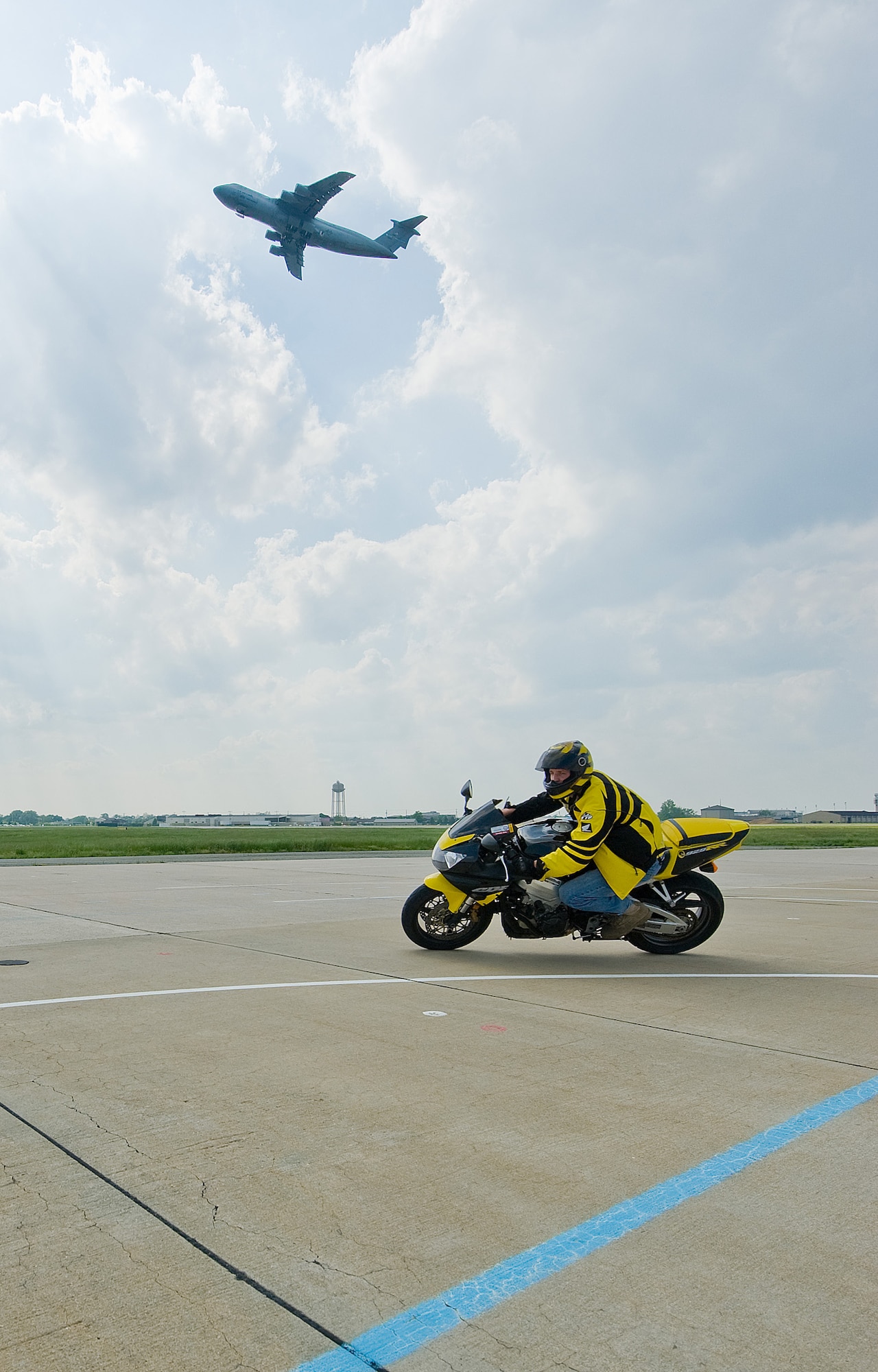Senior Airman Kevin Miller, 436th Maintenance Squadron, learns to properly make turns during a sports bike training class at Dover Air Force Base May 8. All personnel must take or enroll in the Air Mobility Command sport bike course within 30 days of purchasing a sport bike. (U.S. Air Force photo by Tom Randle)

