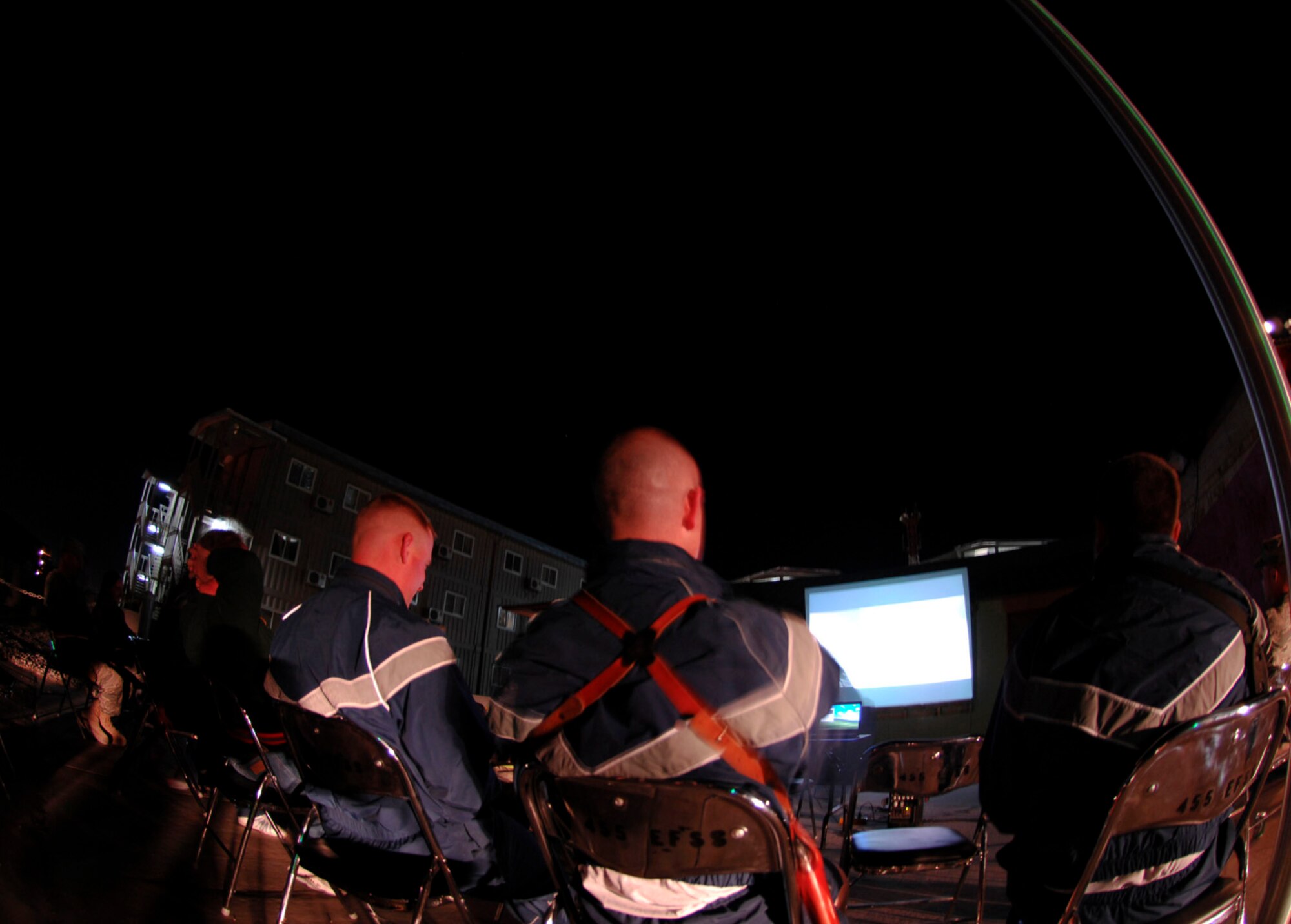 Airmen watch a movie under the stars at Bagram Air Field, Afghanistan, May 14. The event is hosted by the 455th Expeditionary Force Support Squadron every Thursday night. (U.S. Air Force photo/Senior Airman Erik Cardenas)
