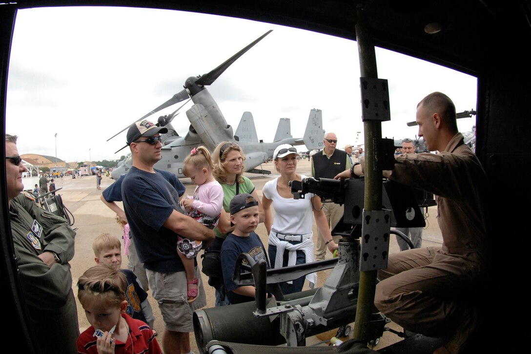 Capt. Dustin Blesha, UH-1N Marine pilot from 269th Helicopter Marine Light Attack, explains the missions of his aircraft during the Joint Service Open House (JSOH) on Andrews Air Force Base, Maryland, May 15, 2009. The JSOH offers an opportunity for service members to meet and thank the public for their support and to show them America's skilled military. (U.S. Air Force photo by Senior Airman Giang Nguyen)