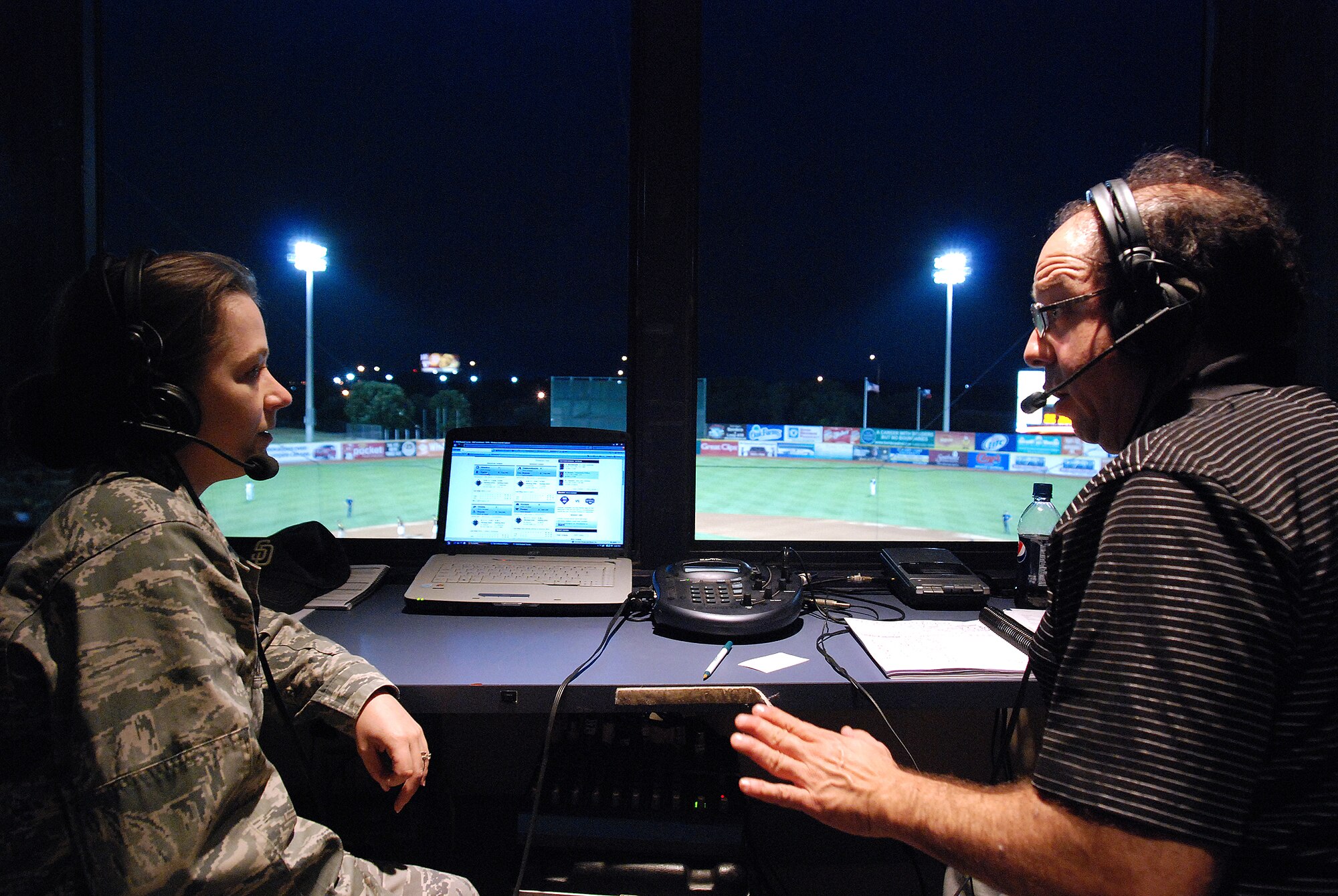 Captian Carla Gleason, a Reservist from the 433rd Airlift Wing from Lackland Air Force Base, gives an interview to Roy Acuff from KKXY radio during a live radio broadcast. Captain Gleason answers questions about the Reserve and U.S. Air Force during the interview,  held on U.S. Reserve Night at the stadium on U.S. Armed Forces Day. (U.S. Air Force photo/Airman Brian McGloin)