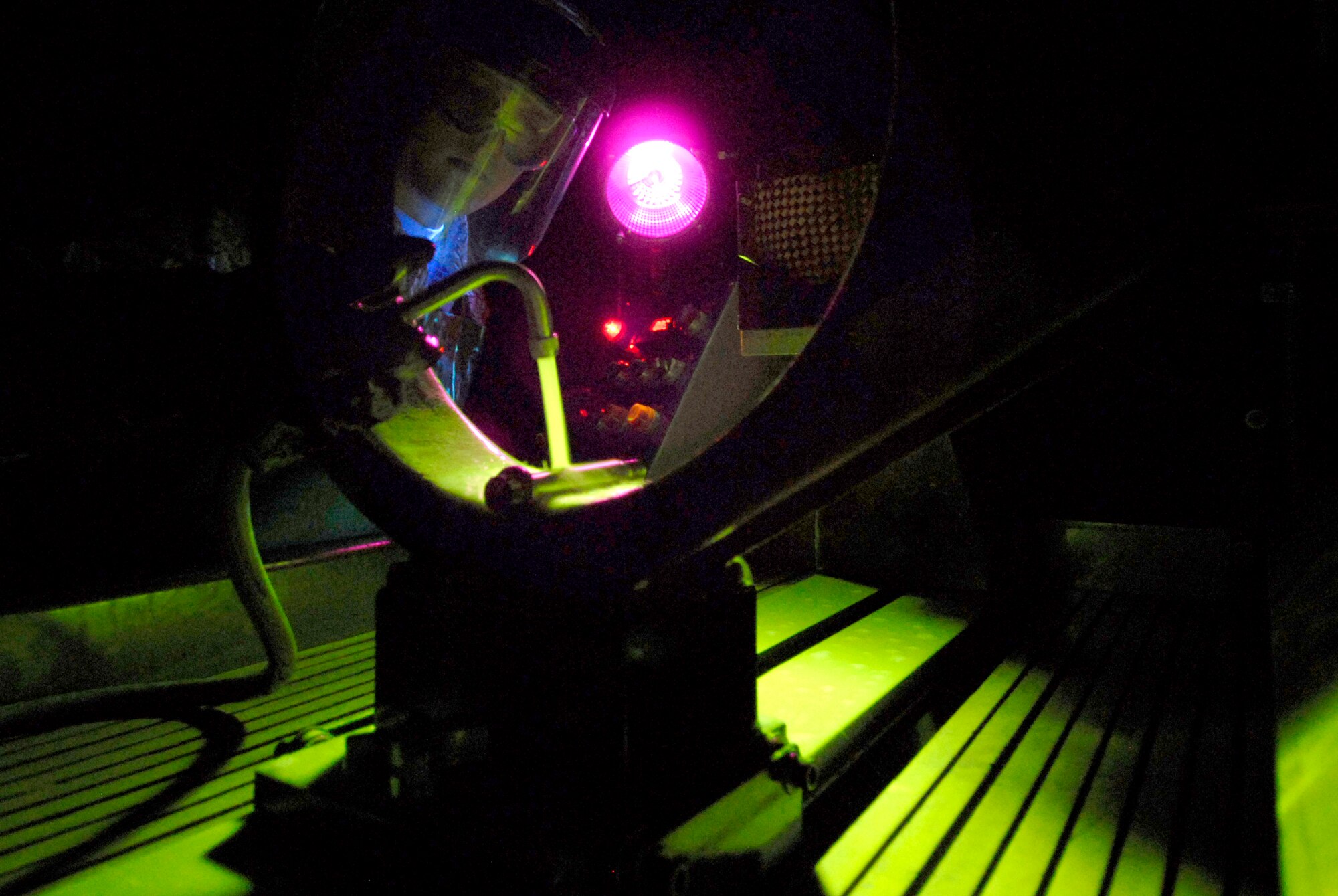 Senior Airman Tyler Koonst, 379th Expeditionary Maintenance Squadron Non-Destructive Inspection (NDI) Journeyman, applies a magnetic particle bath to a bolt from a main landing wheel in order to search for cracks or defects, May 14, 2009 at an undisclosed location in Southwest Asia.  The NDI team inspects aircraft parts for defects or damage and also supports the Joint Oil Analysis Program, throughout the U.S. Central Command's Area of Responsibility.  Airman Koonst hails from Belle Plaine, Minn. and is deployed from the 934th Airlift Wing Air Reserve Station, Minn. in support of Operations Iraqi and Enduring Freedom and Combined Joint Task Force - Horn of Africa.  (U.S. Air Force photo/Senior Airman Andrew Satran/released)    