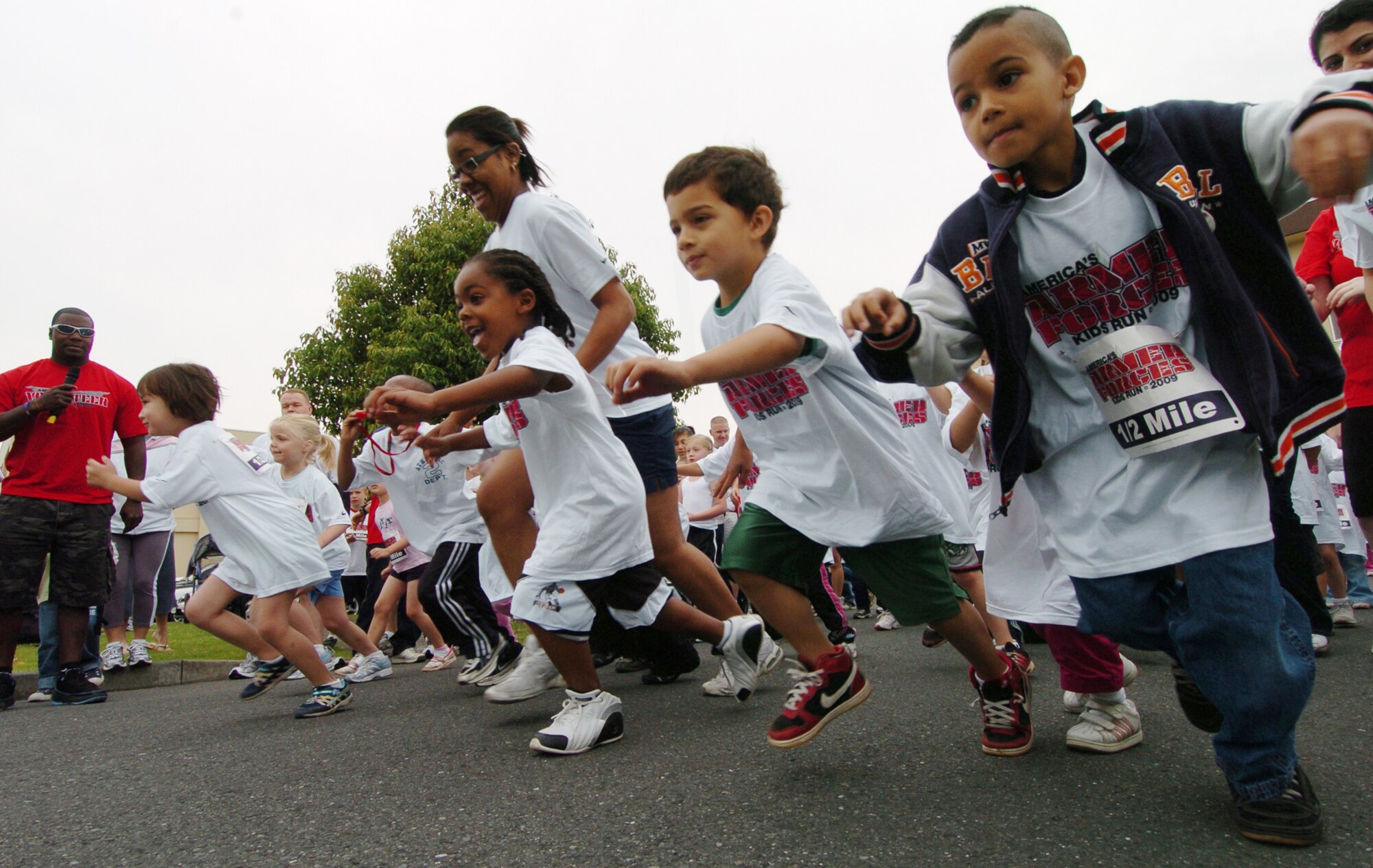 YOKOTA AIR BASE, Japan -- The youngest participants at the Armed Forces Kids Run 2009 fire off the starting line May 16 on the base's west side. More than 100 children took part in the 24th anniversary of the run held at military installations worldwide. It's designed to give children a fun and safe way to exercise. (U.S. Air Force photo/Master Sgt. Matt Summers)