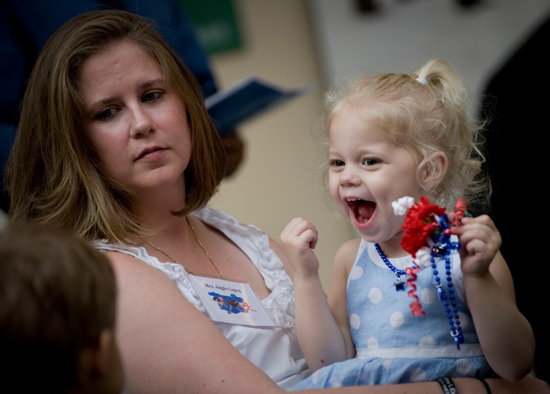 Angie Capra and her daughter Adrianna attend the commemorative book presentation, "For Children of Valor" in honor of the children of the fallen, Arlington National Cemetery, Arlington, Va., May 15, 2009. Angie's husband, Air Force Tech. Sgt. Anthony L. Capra, an  explosive ordnance technician, was killed in a improvised explosive attack in Golden Hills, Iraq in April 2008. DoD photo by U.S. Navy Petty Officer 1st Class Chad J. McNeeley