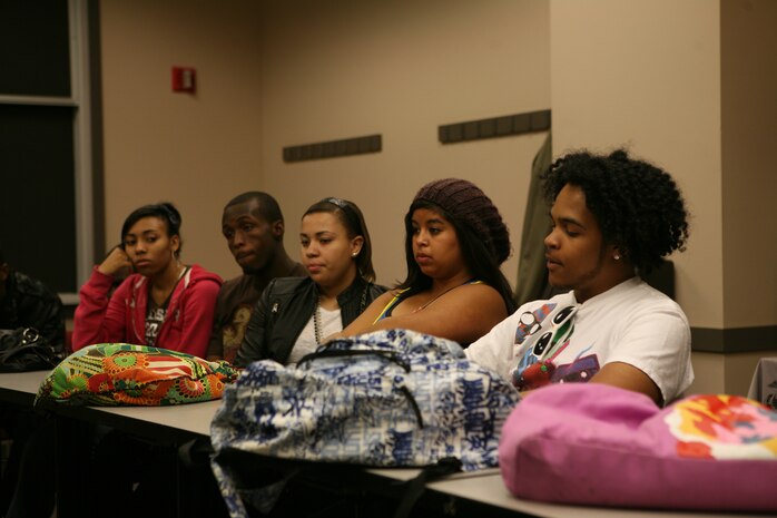 Students in the YMCA Black and Hispanic Acheiver's Program listen to Maj. Shawn D. Haney, 37, explain the importance of communication during a lesson May 16.  Haney also spoke about the ways that communication skills affect each individual student and also its importance within the Marine Corps. The event was part of Marine Week Chicago, held throughout the city this past week.