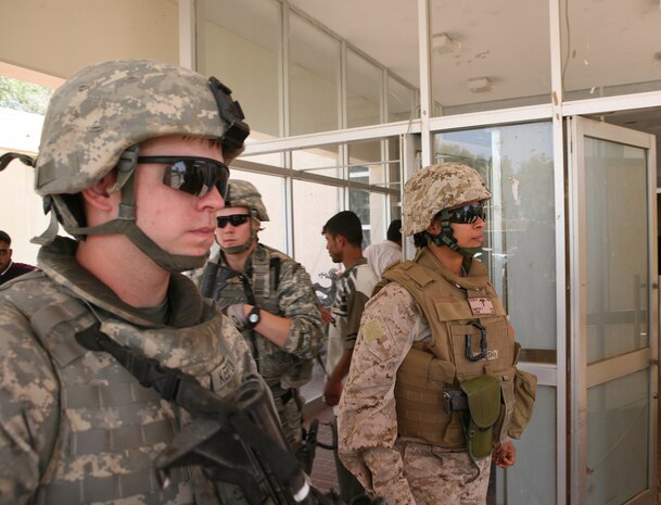 Lt. Cmdr. Tara N. Smith, a clinical psychologist with Combat Logistics Battalion 4, 2nd Marine Logistics Group (Forward), exits the Ramadi General Hospital after meeting with the hospital’s psychologist, May 18, 2009 in Ar Ramadi, Iraq. Smith and members of the Al Anbar Provincial Reconstruction Team, held a meeting with the psychologist to see how they could provide aid to the hospital's mental health program.