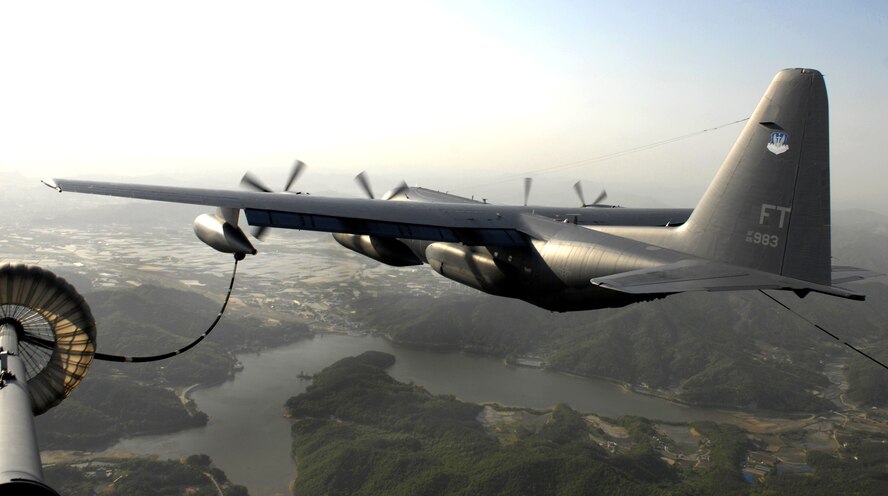 A HC-130P Combat King from the 71st Rescue Squadron at Moody Air Force Base, Ga, simulates refueling a HH-60G Pavehawk over the Republic of Korea May 13, during the first Pacific Thunder Exercise 09-01 hosted at Osan AB.  Pacific Thunder is the largest combat search and rescue exercise ever for Pacific Air Force.(U.S. Air Force photo/Senior Airman Stephenie Wade)