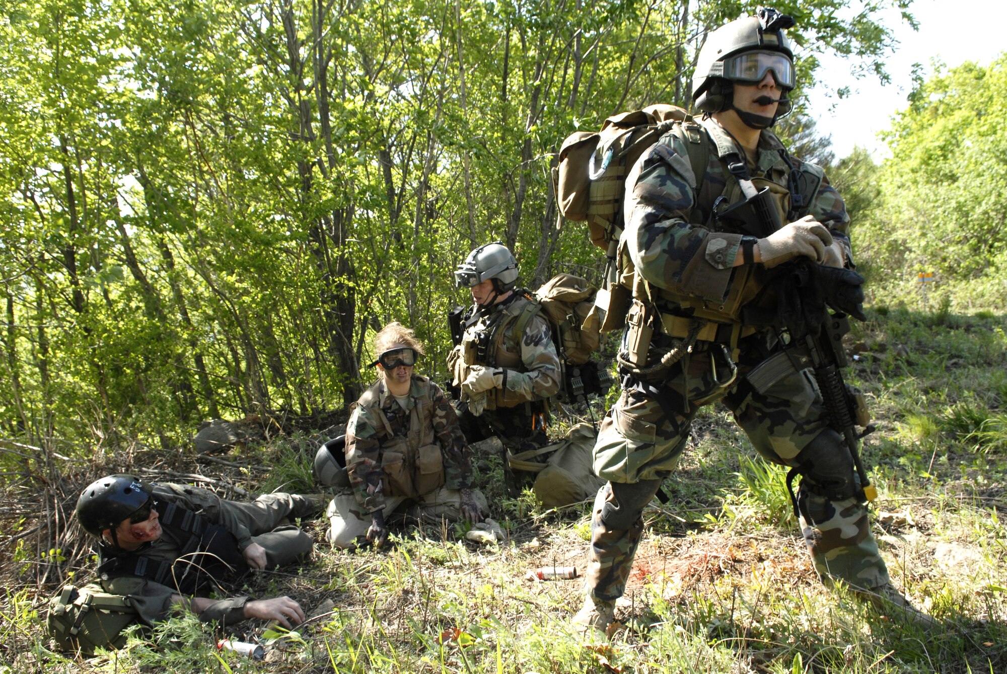 A pararescueman watches for the rescue helicopter, a HH-60G Pavehawk while the injured are treated after a simulated C-130 crash during exercise Pacific Thunder 09-01 hosted by Osan AB, Republic of Korea May 13. The crash left two Airmen non-ambulatory and four severely injured. The overall goal of the exercise is to practice integrating all airframes necessary to rescue a downed Airman in a medium to high threat environment.   Pacific Thunder is the largest combat search and rescue exercise ever for Pacific Air Force.   (U.S. Air Force photo/Senior Airman Stephenie Wade)