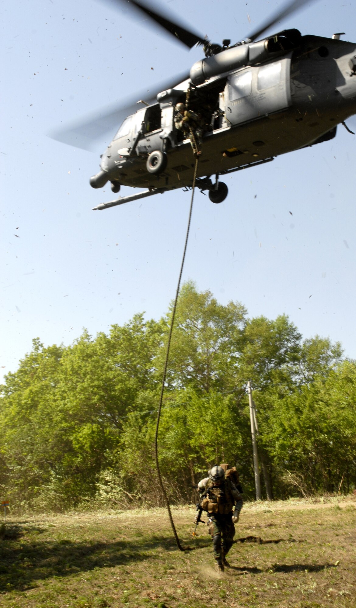 Pararescuemen from the 31st Rescue Squadron, Kadena Air Base Japan climb out a HH-60G Pavehawk to respond to the survivors of a simulated C-130 crash during the exercise Pacific Thunder 09-01 hosted by Osan AB Republic of Korea, May 13. The crash left two Airmen non-ambulatory and four severely injured. The overall goal of the exercise is to practice integrating all airframes necessary to rescue a downed Airman in a medium to high threat environment.   Pacific Thunder is the largest combat search and rescue exercise ever for Pacific Air Force.   (U.S. Air Force photo/Senior Airman Stephenie Wade)